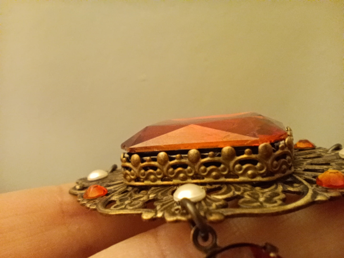 Brass filigree butterfly and red crystals necklace