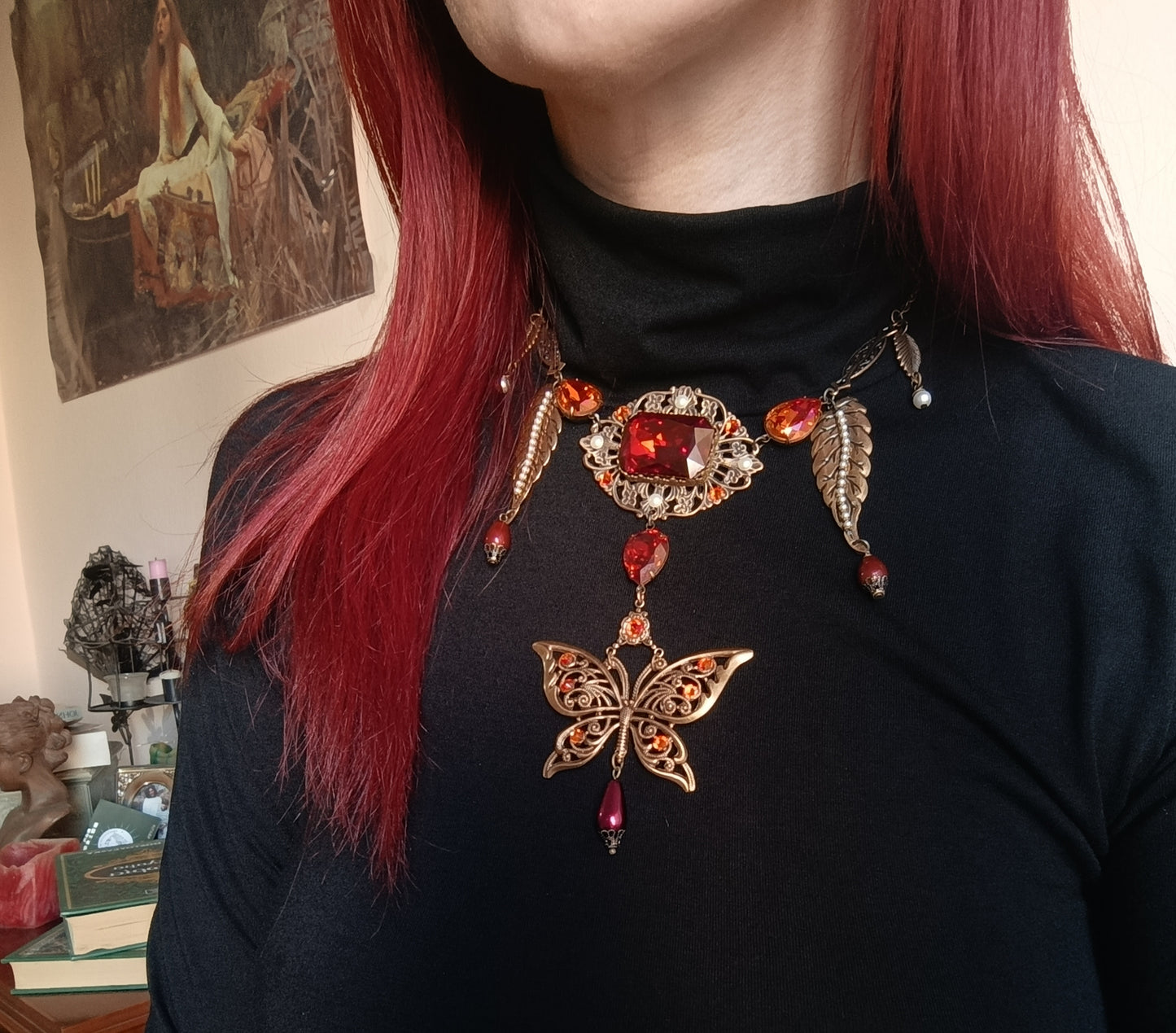 Brass filigree butterfly and red crystals necklace