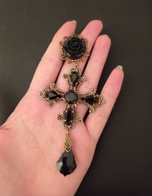 Large statement earrings inspired by Dolce and Gabbana's black and gold style! Detailed gold crosses have their edges accentuated by pointy black crystals with a black rose in the centre.