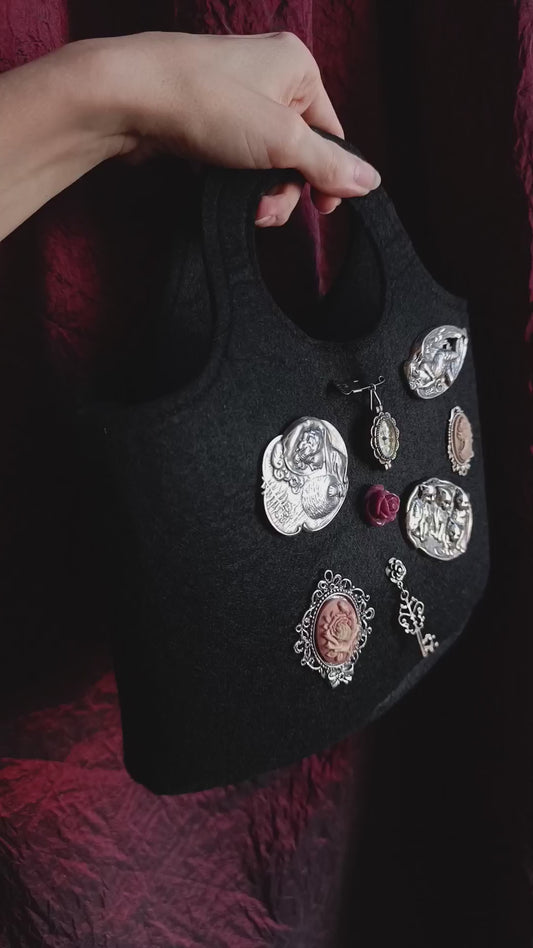 Felt bag with vintage brooches