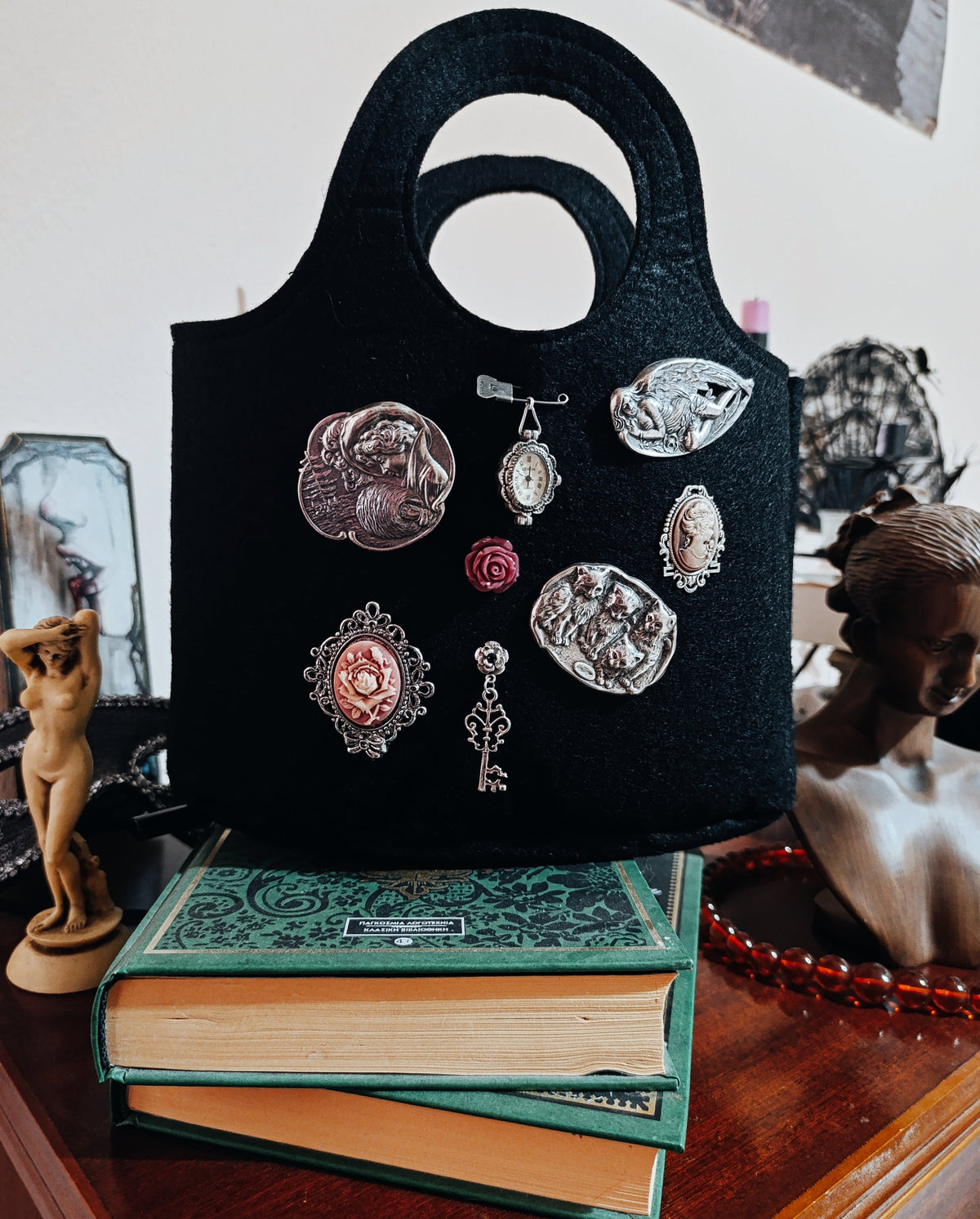 Felt bag with vintage brooches