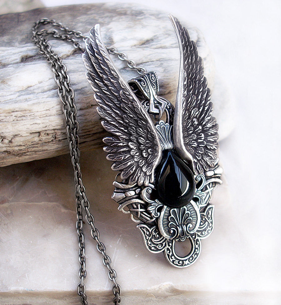 Gothic Dark Angel pendant with large silver Wings and Black Onyx cabochon.