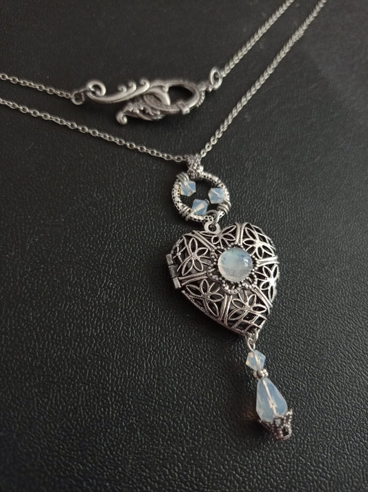 Express your romantic side with this vintage style antiqued silver filigree Heart shaped Locket Necklace with Moonstone cabochon and White opal Crystals. Victorian jewelry by Aranwen.
